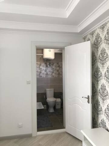 Фото номера Двухместный номер Делюкс с 1 кроватью и душем Гостевой дом Guest House “Aura” г. Чолпон-Ата 6